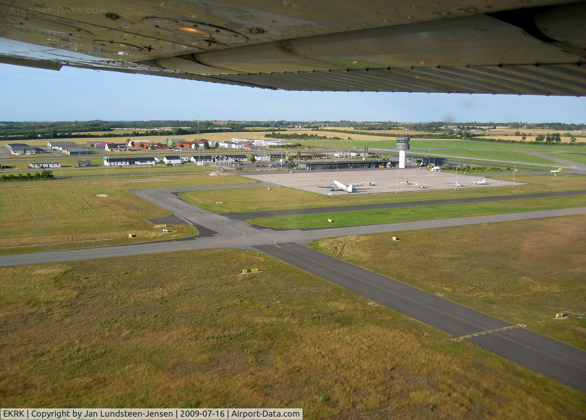 Roskilde Airport, Roskilde Airport in Denmark seen from Cessna 172 OY-JDL shortly after takeoff from Runway 29 on a flight to the Danish island of Samso. Former Danish Air Force C-47 OY-BPB seen on apron.