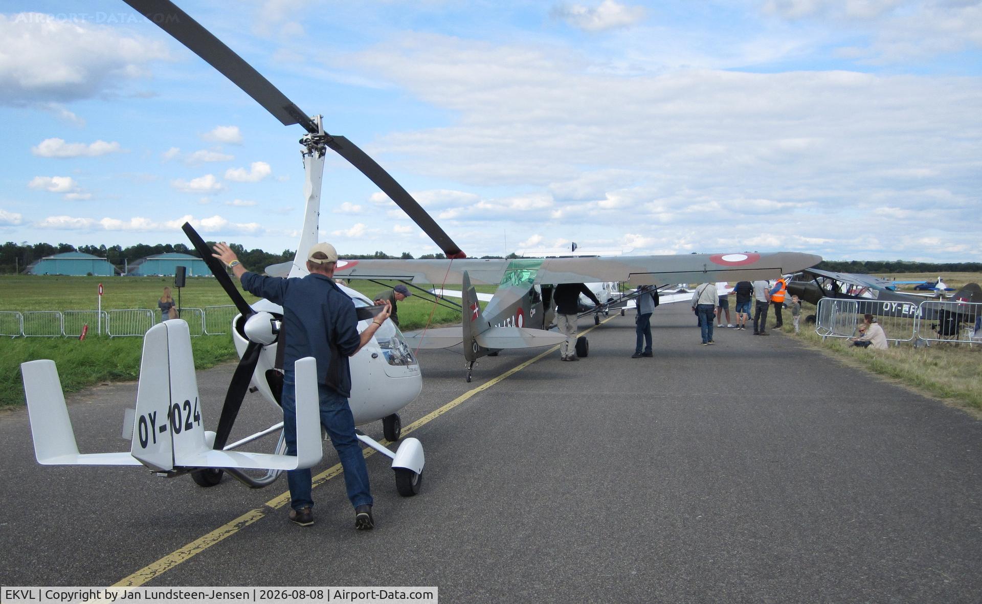 Værløse Air Base Airport, Aircraft on Taxiway Charlie South being prepared to leave an airshow at the former Vaerloese Air Base in Denmark. Nearest an AutoGyro Calidus and in front an ex Danish Army Piper Super Cub., photo by Jan Lundsteen-Jensen