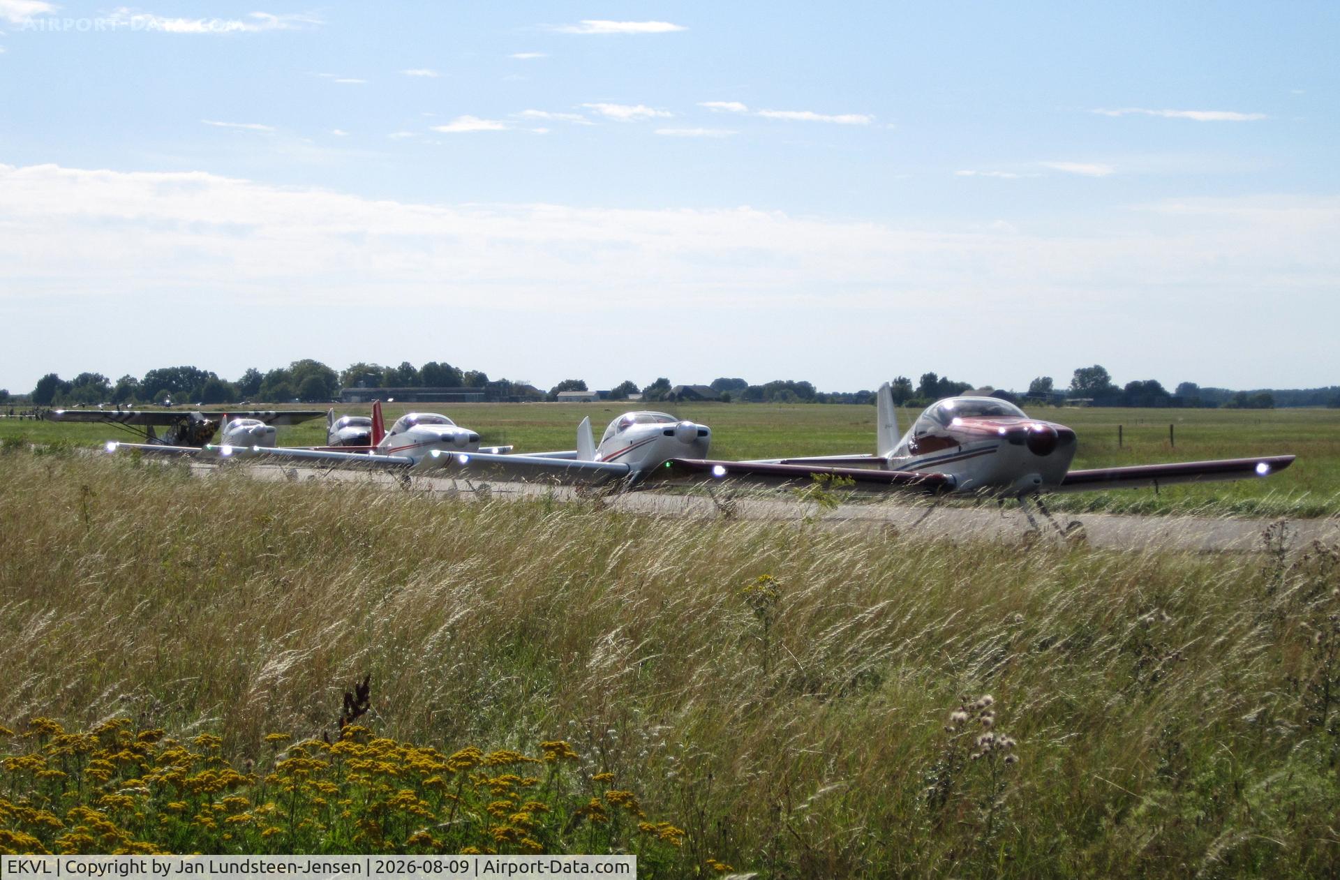 Værløse Air Base Airport, 5 Vans RVs of RVators Formation Team and a Piper L-4H taxiing to the runway at an airshow at the former Vaerloese Air Base in Denmark., photo by Jan Lundsteen-Jensen